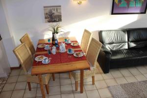 a dining room table with plates of food on it at Spacious House in Sylt-Ost, Garden in Tinnum