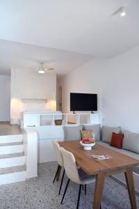 a living room with a table and a couch at Syllac Elegant Stay in Dhriopís