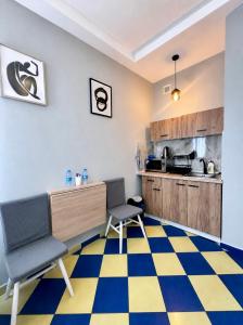 a room with two chairs and a kitchen at Kael Apartment 2 in Teplice +40 photos