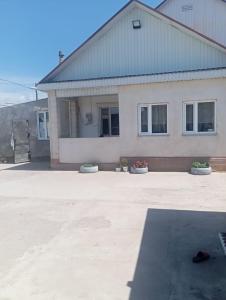 a large house with a driveway in front of it at Adelina in Kyzart