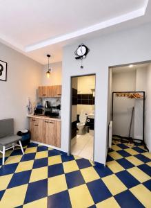 a living room with a checkered floor at Kael Apartment 2 in Teplice