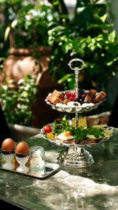 a table with two plates of food on a table at ROH Suites in Athens