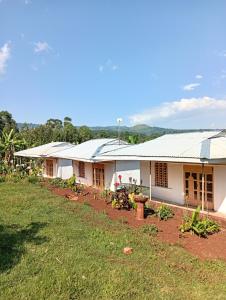 a building with solar panels on the side of it at Lago Resort - Kakamega Forest in Kakamega