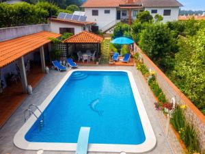an overhead view of a swimming pool on a house at Spacious Villa with Private Pool in Oliveira de Azeméis in Oliveira de Azemeis