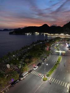an aerial view of a city with a street and the water at SunWay hotel in Cat Ba