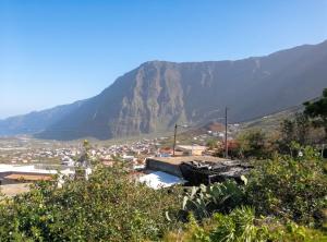 a view of a town with a mountain in the background at Modern apartment in Frontera, 45 m² with sea view balcony in Frontera