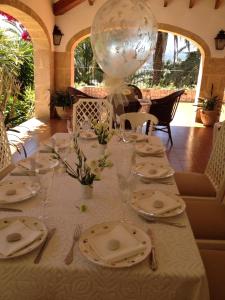 a table with plates and a balloon on top of it at Seaside villa in Jávea with private pool in Jávea