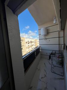 an empty room with a view of a window at Flowers in Bouznika