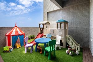 a play set with a table and chairs and a tent at Yuan Lu Homestay in Lukang