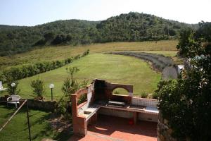 an outdoor amphitheater in the middle of a field at Quaint house in Murlo with shared pool in Murlo