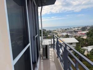 a balcony with a view of the ocean at Panatina Sunset Residence in Honiara