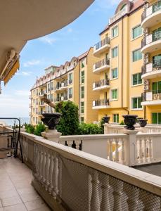 a balcony with a view of some buildings at Coastal Studio with Sea View in Elenite, 40m² + Pool in Elenite