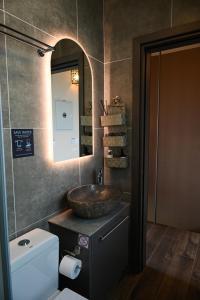 a bathroom with a sink and a mirror at Exotic Sea Boutique Adults Only in Protaras +40 photos