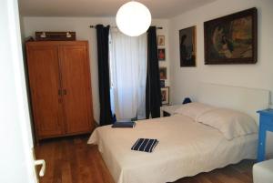 a bedroom with a white bed and a wooden floor at Spacious house in Lukoran with sea view in Lukoran +83 photos