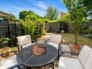 a patio with a table and two chairs at Chilton Charm Modern 3BR Ideal for Long Stays in Chilton