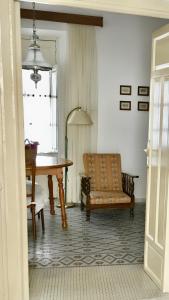 a dining room with a table and a chair at Charming Apartment in Albuñol, 90 m², Near Amenities in Albuñol
