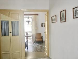 a hallway with a door open to a living room at Charming Apartment in Albuñol, 90 m², Near Amenities in Albuñol
