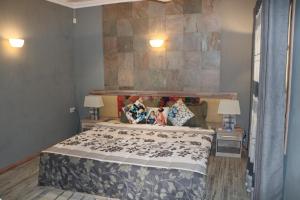 a bedroom with a large bed and two lamps at Charming Studio in Blue Bay, 22 m², Near Beaches in Blue Bay
