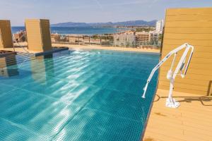 a swimming pool on the roof of a building at Modern Apartment in Salou - 50 m² + Pool in Salou