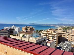 a view of a city with buildings and the ocean at Modern Apartment in Salou - 50 m² + Pool in Salou