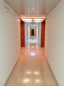 an empty hallway in a building with a long corridor at Modern Apartment in Salou - 50 m² + Pool in Salou