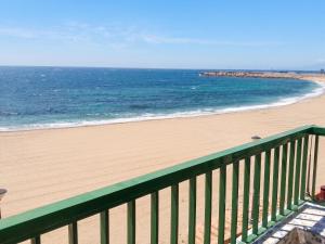 a view of the beach from a balcony at Apartment with pool in Águilas 75 m² with sea view in Águilas