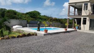a swimming pool in the backyard of a house at Luxurious Villa in Pereybere with Pool in Pereybere