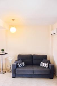 a living room with a couch and a table at Cozy apartment in Dénia, 40 m² with shared pool in Denia