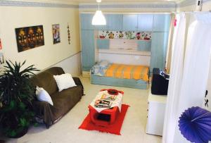 a living room with a couch and a bed at Spacious Apartment Sintra 120 m² + Pool in Sintra