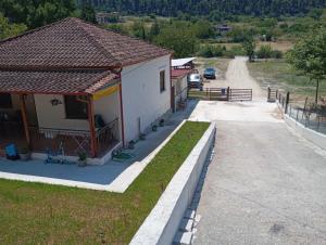 a small house with a road next to it at MP House Kassandrino Halkidiki in Kassandrinón