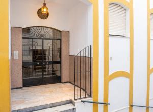 a hallway with a staircase in a building at Comfortable Apartment in Almuñécar in Almuñécar