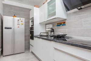 a kitchen with a refrigerator and a counter top at Charming House in Costa Calma with Mountain View and Terrace in Costa Calma
