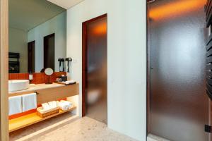 a bathroom with a sink and a mirror at NOLIA Boutique Hotel in Porto +104 photos