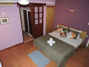 a bedroom with a bed with a cross on it at Charming villa in Blue Bay with private pool in Blue Bay +19 photos