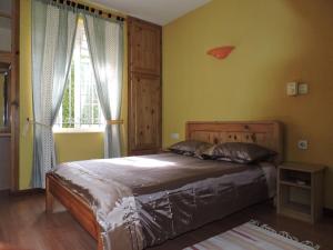 a bedroom with a bed and a window at Charming villa in Blue Bay with private pool in Blue Bay