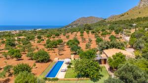an aerial view of the property with a swimming pool and trees at Finca Ca`n Jaumí, un paraíso con vista al mar y a la montaña in Artá