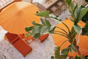 an overhead view of a patio with umbrellas and chairs at Nice Excelsior Centre ville by HappyCulture in Nice +47 photos
