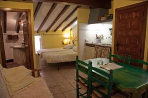 a small room with a kitchen and a bedroom at Comfortable Apartment in Robledillo de Gata with Balcony and View in Robledillo de Gata +11 photos