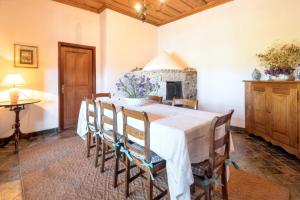 a dining room with a table with chairs and a fireplace at Charming Villa with Private Pool in Lamego in Lamego