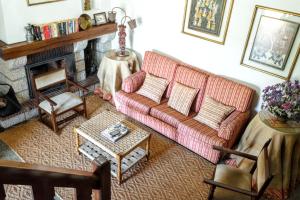 a living room with a couch and a fireplace at Charming Villa with Private Pool in Lamego in Lamego +43 photos