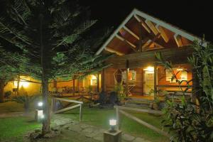 a house at night with two lights in front of it at Charming Bungalow in Tarifa with Mountain View in Tarifa +10 photos