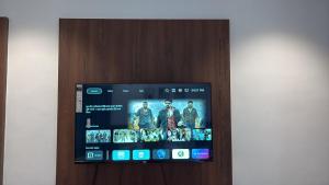 an image of a tablet screen on a wall at Hotel Pride in Wardha