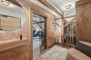 a living room with a mirror and a couch at Apartmány Wake up Coffee in Proseč +61 photos