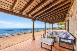 an outdoor patio with a view of the ocean at CERCADO DEL MEDIO, CHALET con PISCINA PRIVADA in Adeje