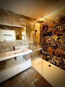 a bathroom with a sink and a shower at Cit'Art in Namur +25 photos