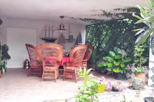 a patio with wicker chairs and a table on a patio at Elegant Villa in Tui with Private Pool in Tui +27 photos