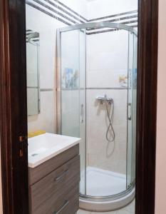a bathroom with a shower and a sink at Charming Apartment in Imi Ouaddar in Agadir nʼ Aït Sa