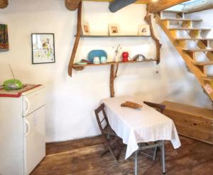 a kitchen with a table and a staircase in a room at Charming Villa in Filozići with Private Pool in Filozići