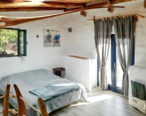 a bedroom with a bed and a window at Charming Villa in Filozići with Private Pool in Filozići