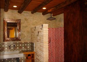a bathroom with a tile shower with a mirror at Charming Villa in Llobera with Private Pool in Llanera +23 photos